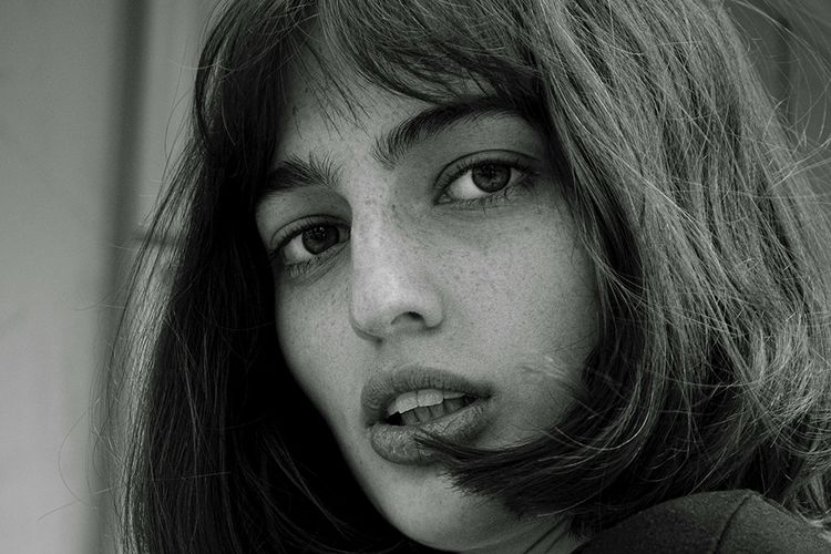black and white photo of woman with bobs and bangs