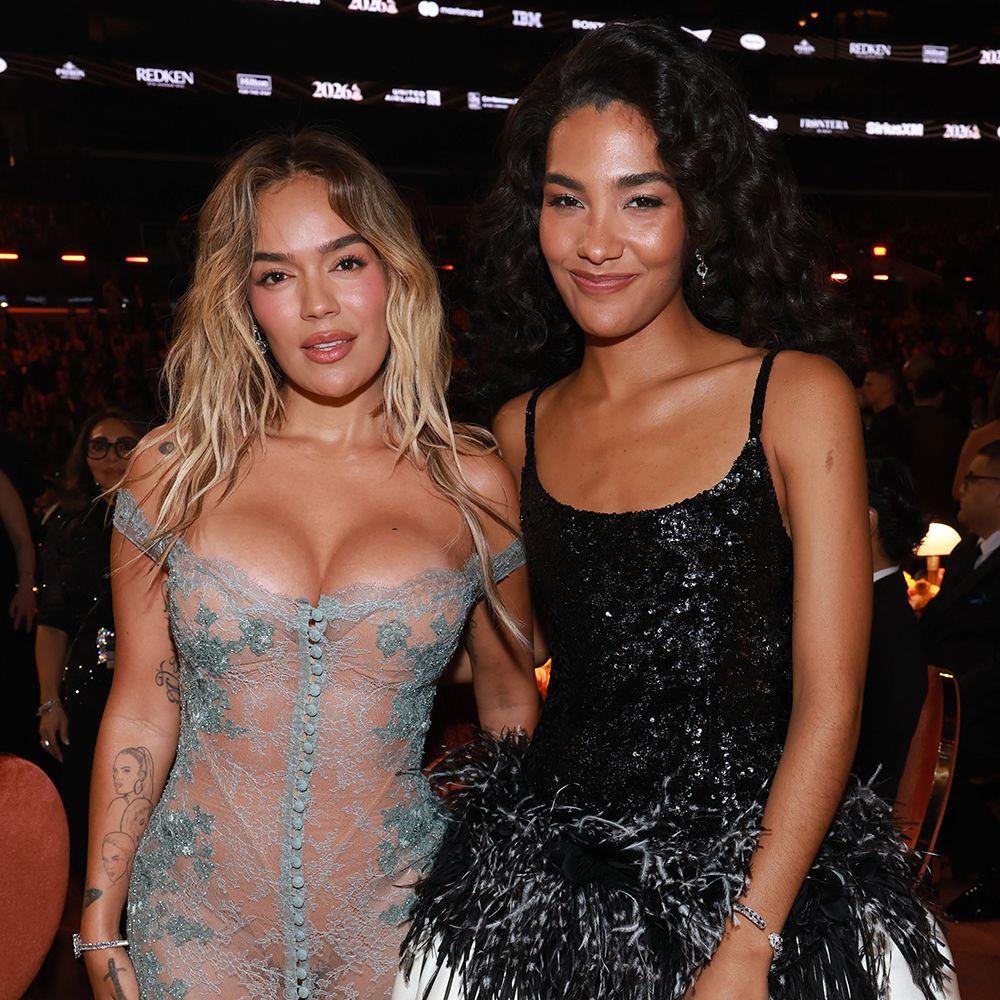 LOS ANGELES, CALIFORNIA - FEBRUARY 01: (L-R) Karol G and Olivia Dean attend the 68th GRAMMY Awards at Crypto.com Arena on February 01, 2026 in Los Angeles, California.  (Photo by Kevin Mazur/Getty Images for The Recording Academy)