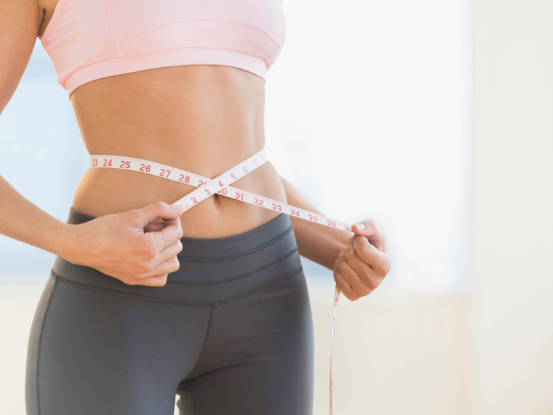 woman measuring waist