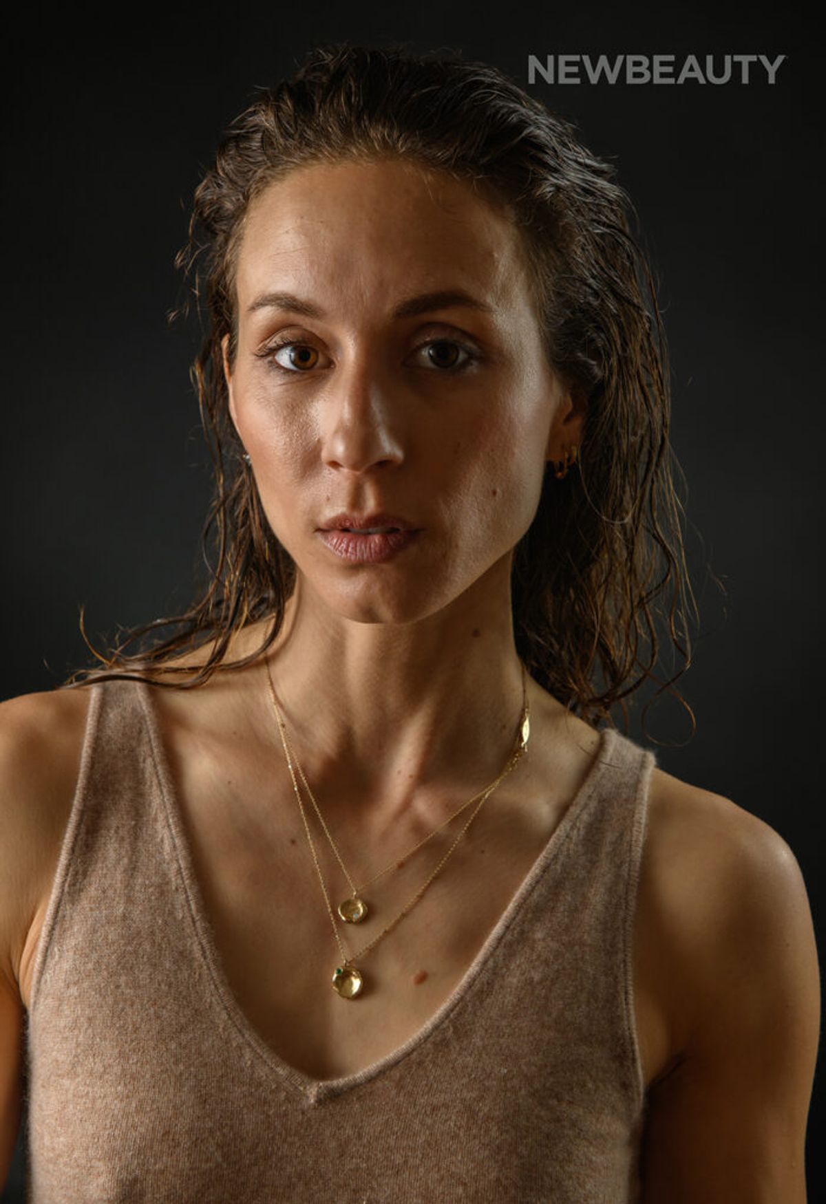 Troian Bellisario on black background