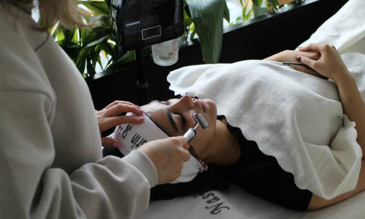woman laying down getting a skin treatment