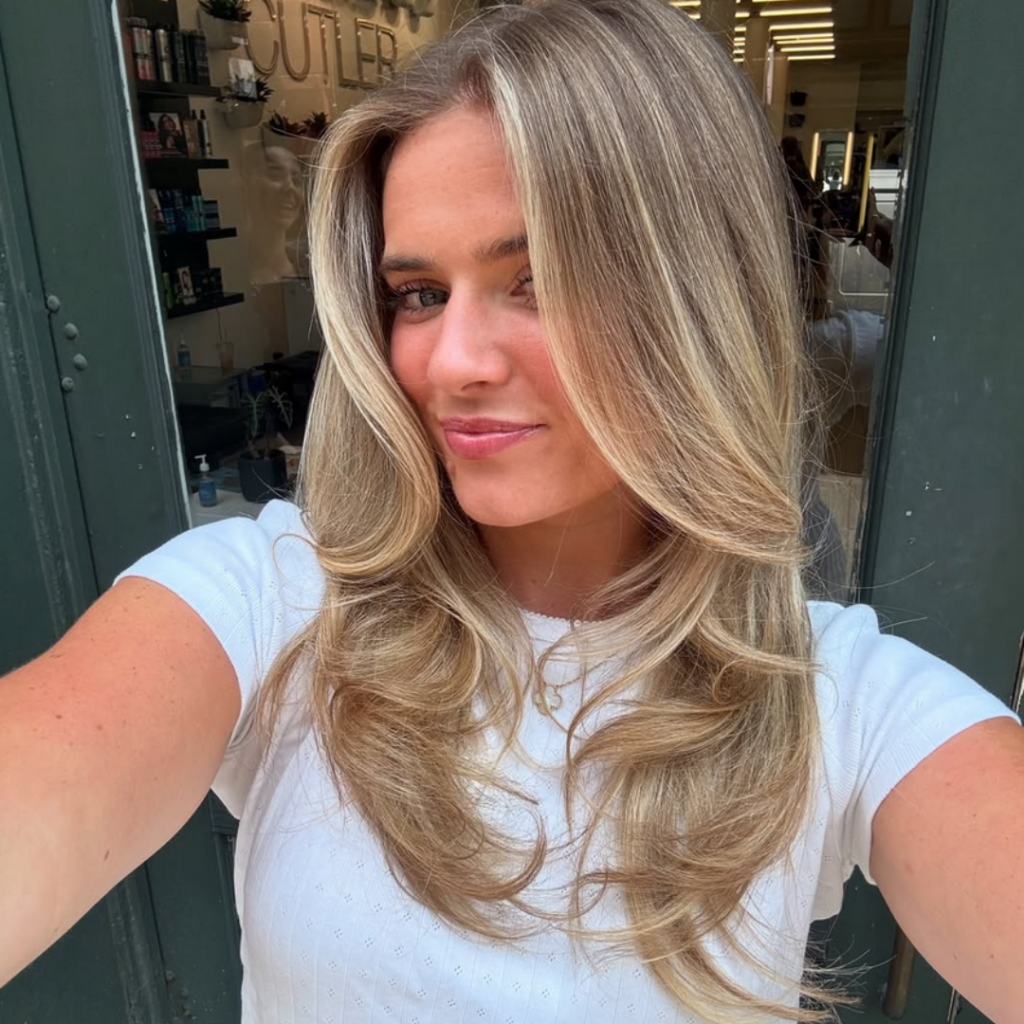 camel coat blonde IG: @maddycolorist_nyc