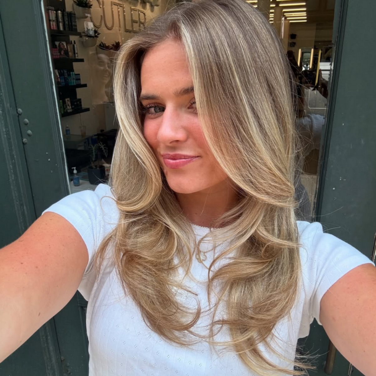 camel coat blonde IG: @maddycolorist_nyc