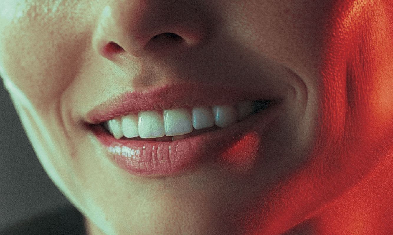 wide birds eye shot, woman in her 40s with a big smile on her face, professional color grading, transparents, film still, Denis Villeneuve style (previous spread)