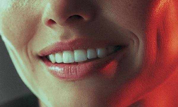 wide birds eye shot, woman in her 40s with a big smile on her face, professional color grading, transparents, film still, Denis Villeneuve style (previous spread)