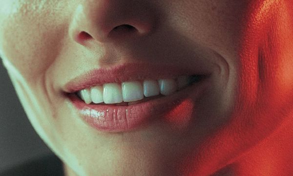 wide birds eye shot, woman in her 40s with a big smile on her face, professional color grading, transparents, film still, Denis Villeneuve style (previous spread)