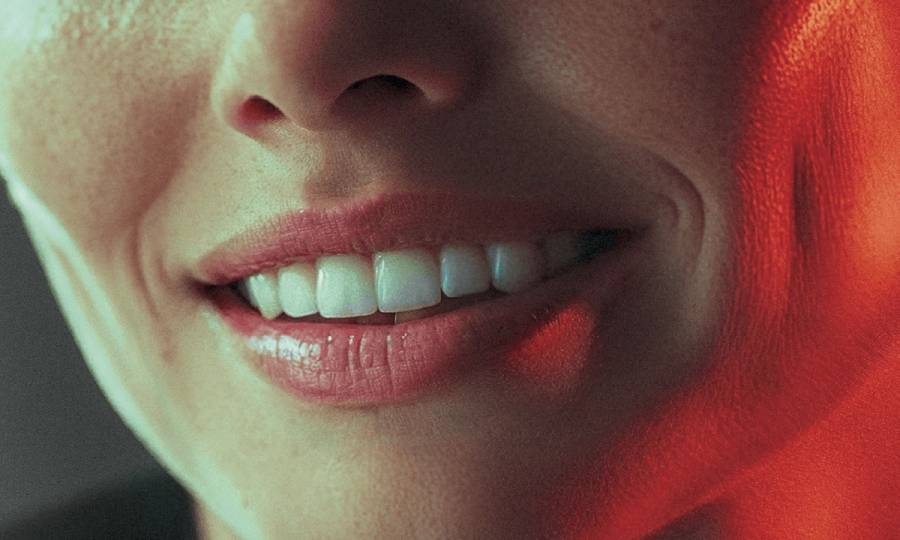 wide birds eye shot, woman in her 40s with a big smile on her face, professional color grading, transparents, film still, Denis Villeneuve style (previous spread)
