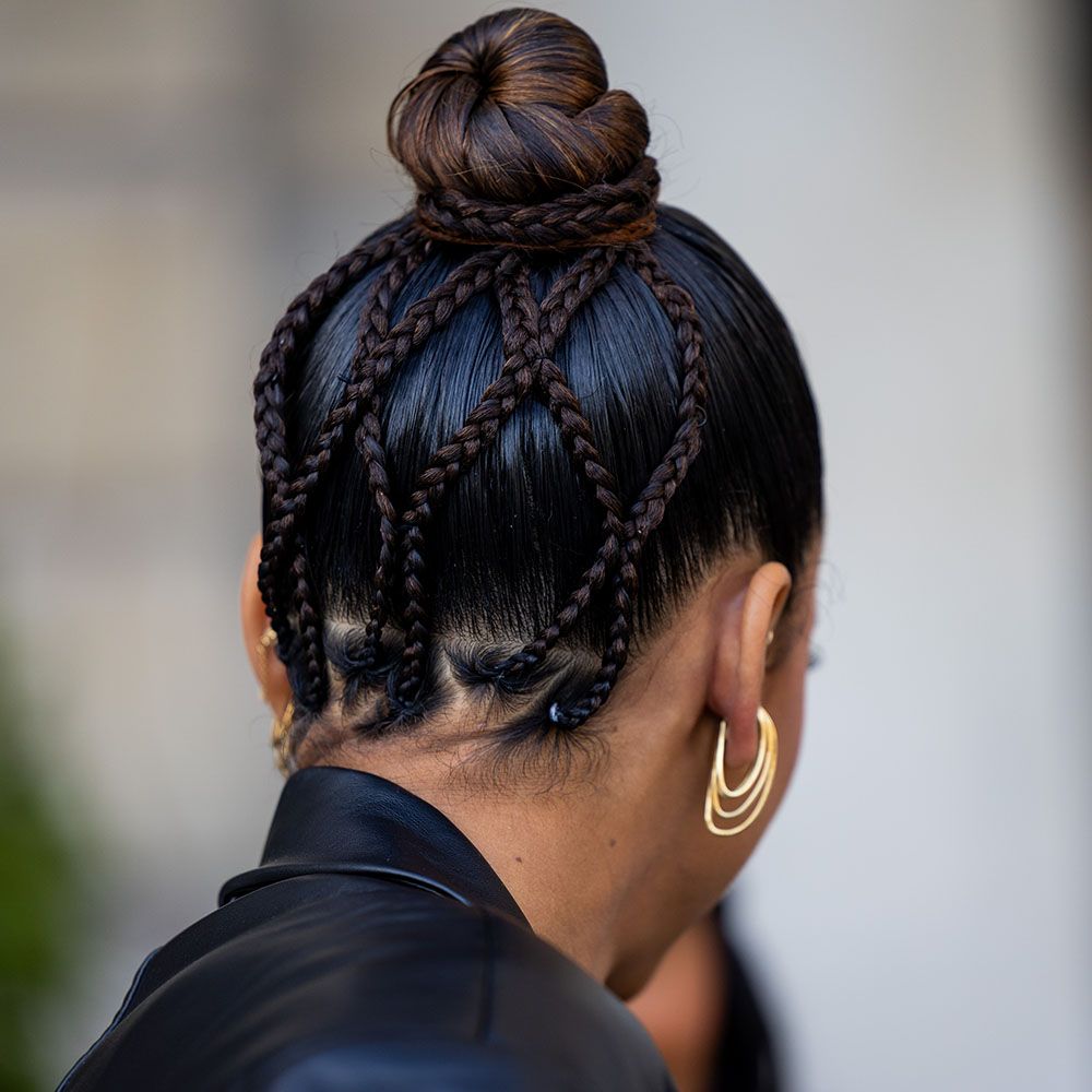 Back view of woman with a patterned braid and bun hairstyle