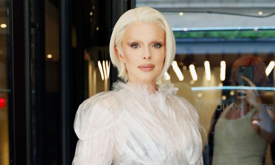 Julia Fox wearing white dress with blonde hair and bleached eyebrows