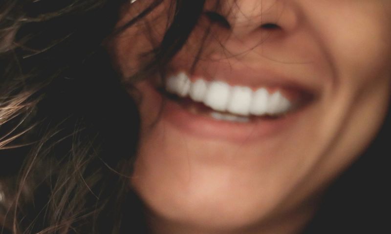 Up close view of smiling woman's lower face