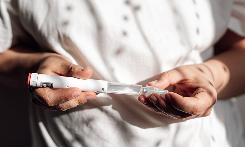 Obese fat woman injecting Semaglutide injection control blood sugar levels