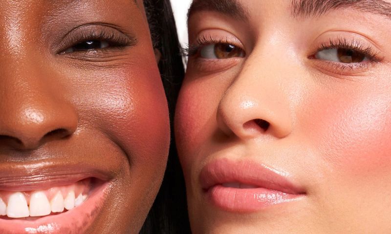 Two women side by side wearing red blush