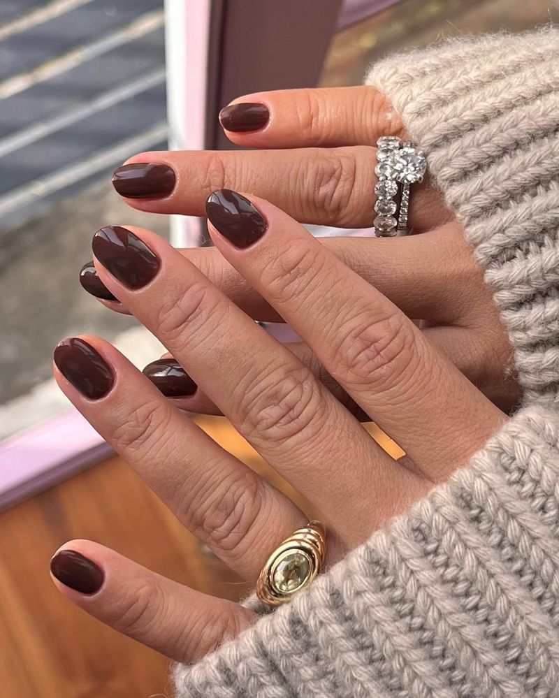 short nails with dark brown nail polish