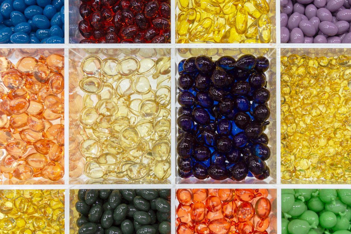 multi colored softgel capsules in tray