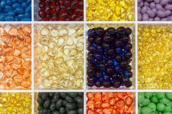 multi colored softgel capsules in tray