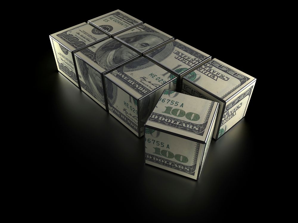 puzzle blocks that come together to look like a $100 bill