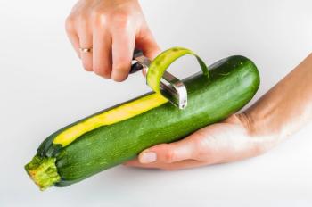 zucchini being peeled