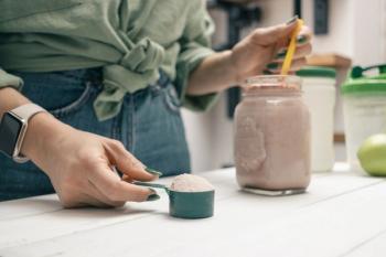woman mixing a protein shake