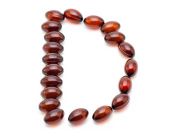 capsules in the shape of the letter "D"