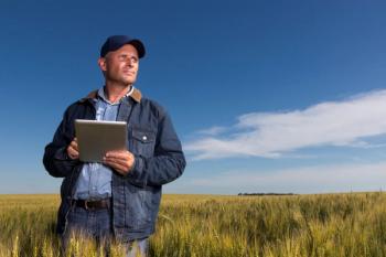 farmer on field with tablet