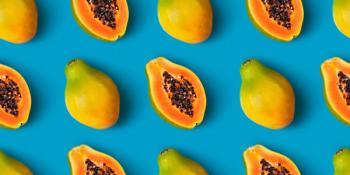 Papaya fruit seamless pattern on blue color background
