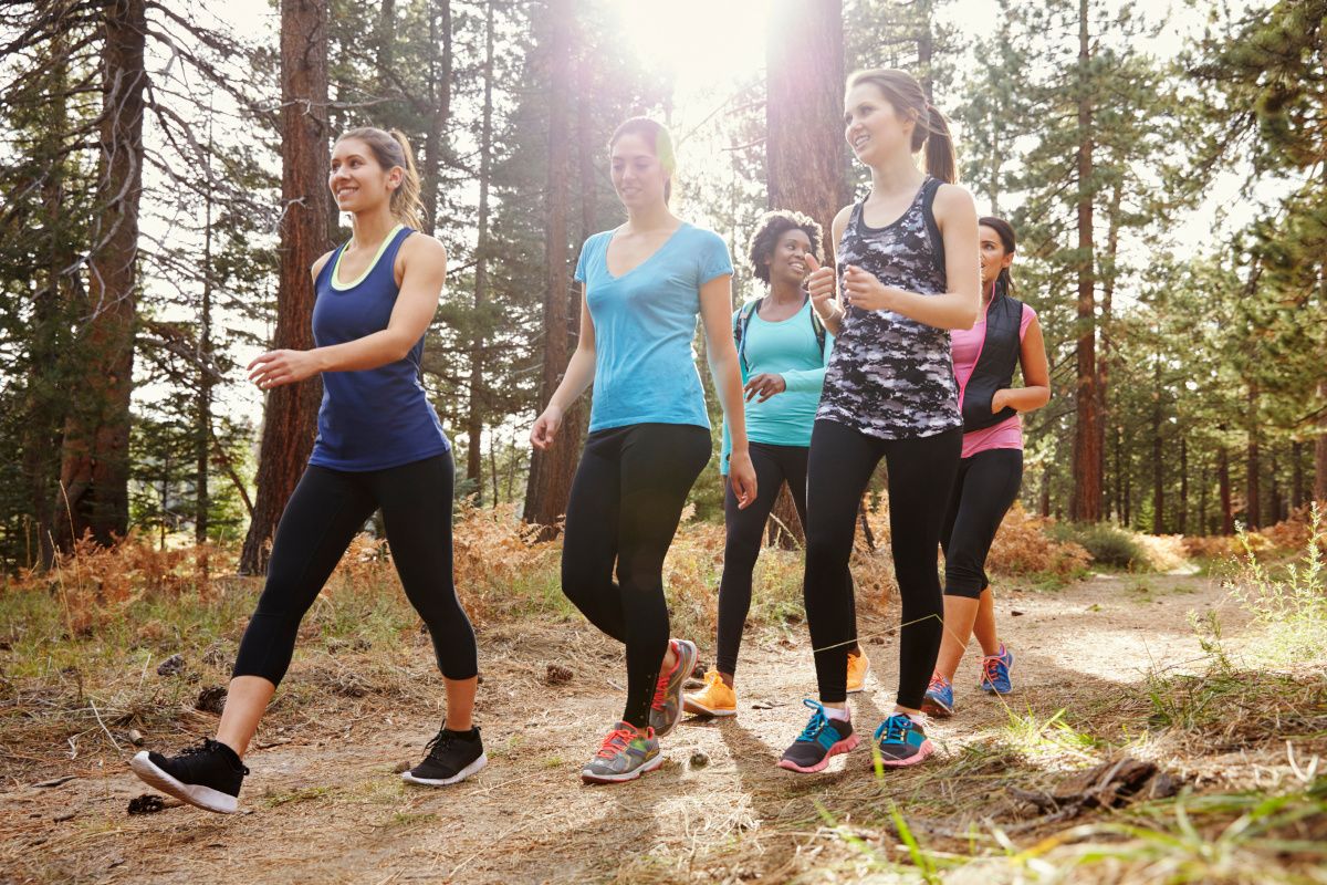 group of women hiking in the woods
