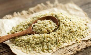 pile of hemp seeds with spoon