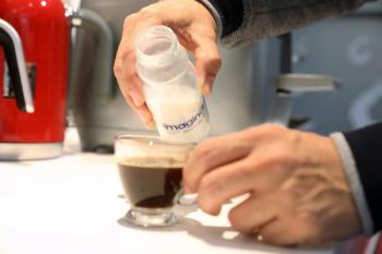 Animal-free dairy milk being poured into coffee