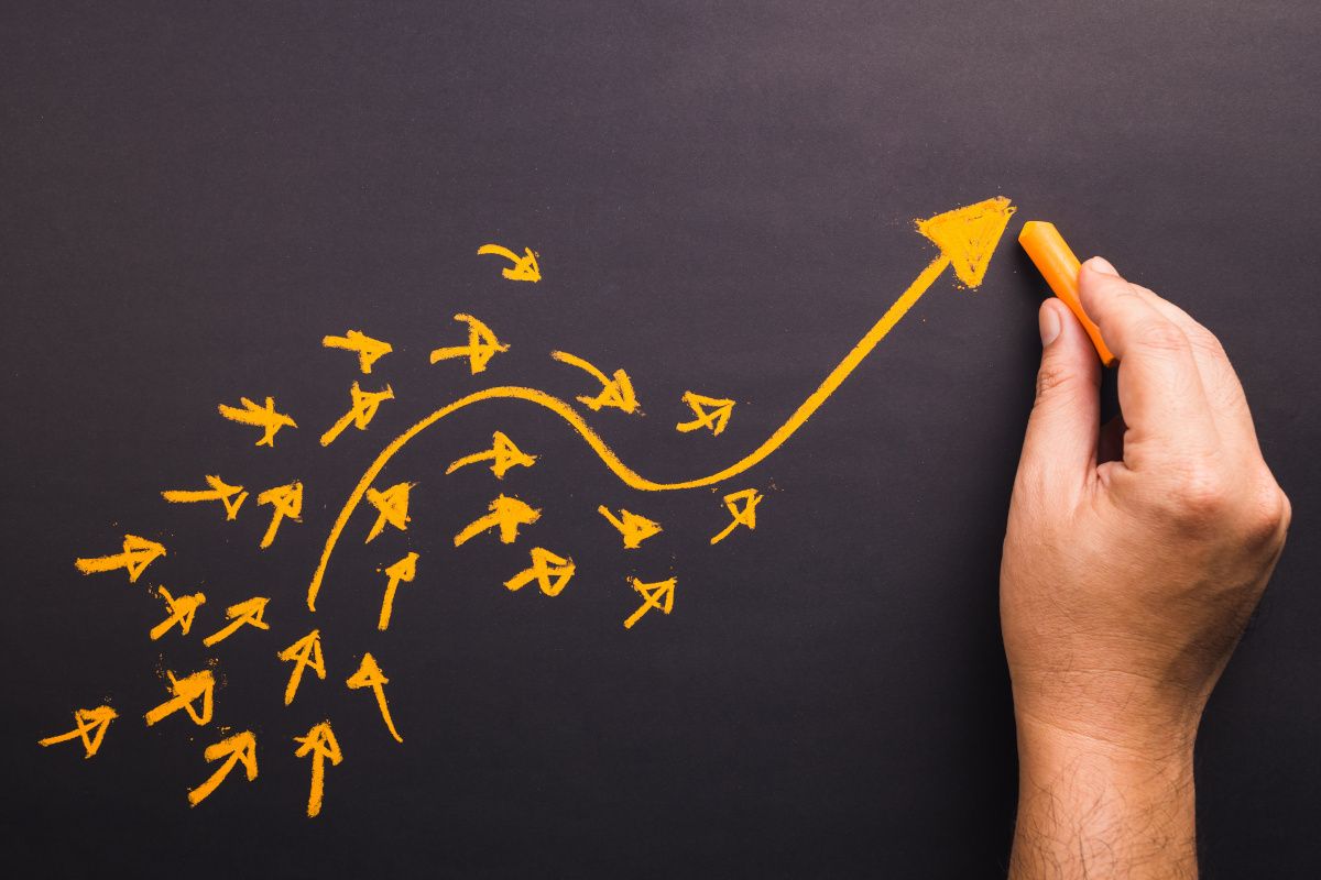 arrows on chalkboard depicting trends