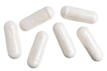capsules with white powder representing creatine