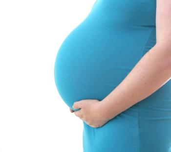 pregnant belly in blue dress