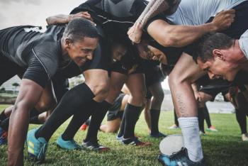 rugby athletes playing on field