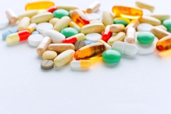 different tablets and capsules scattered on a table