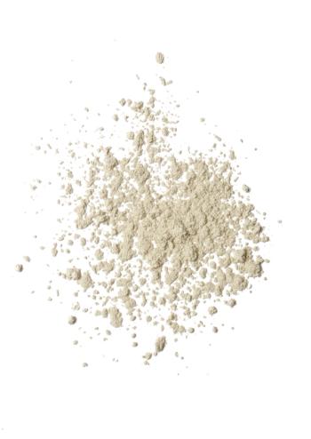 powder on white background representing colostrum