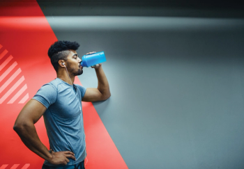 man drinking sports beverage
