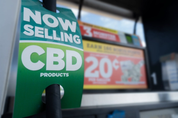 sign at gas station indicating the sale of CBD