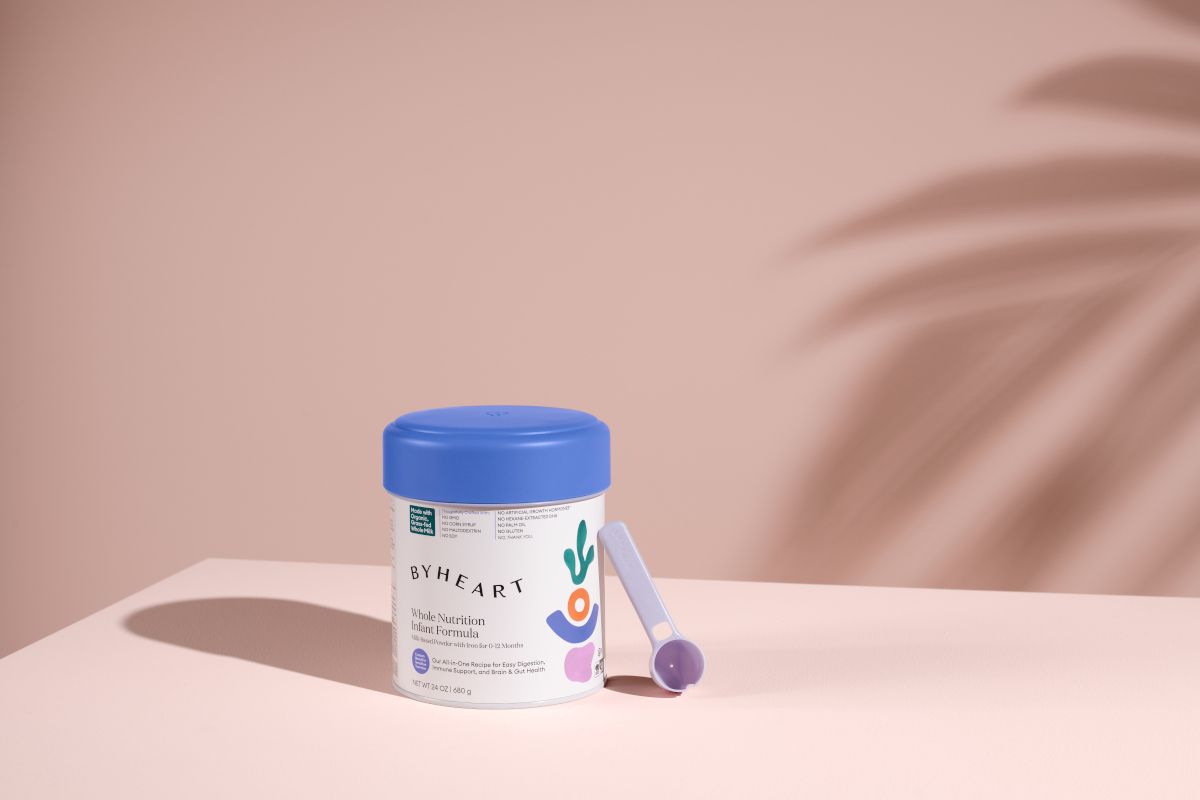 ByHeart container with scoop on pink background