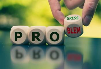 blocks that spell out either problem or progress