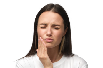 woman holding cheek in pain