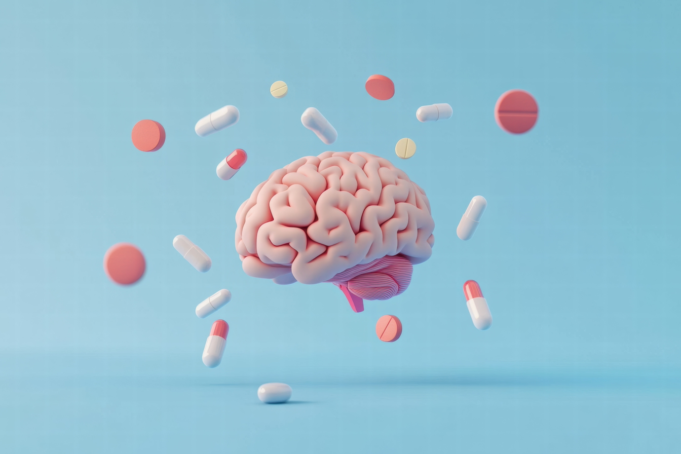 brain surrounded by pills and capsules