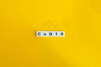 tiles that spell out CoQ10 on yellow background