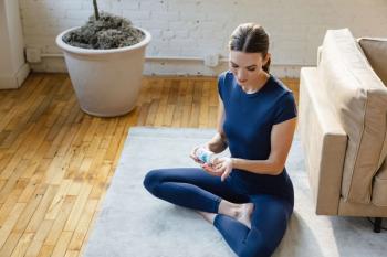 Karlie Kloss putting Thorne supplements into her hand