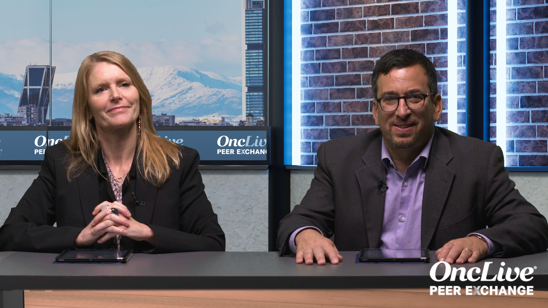 Two experts on lung cancer seated at a table