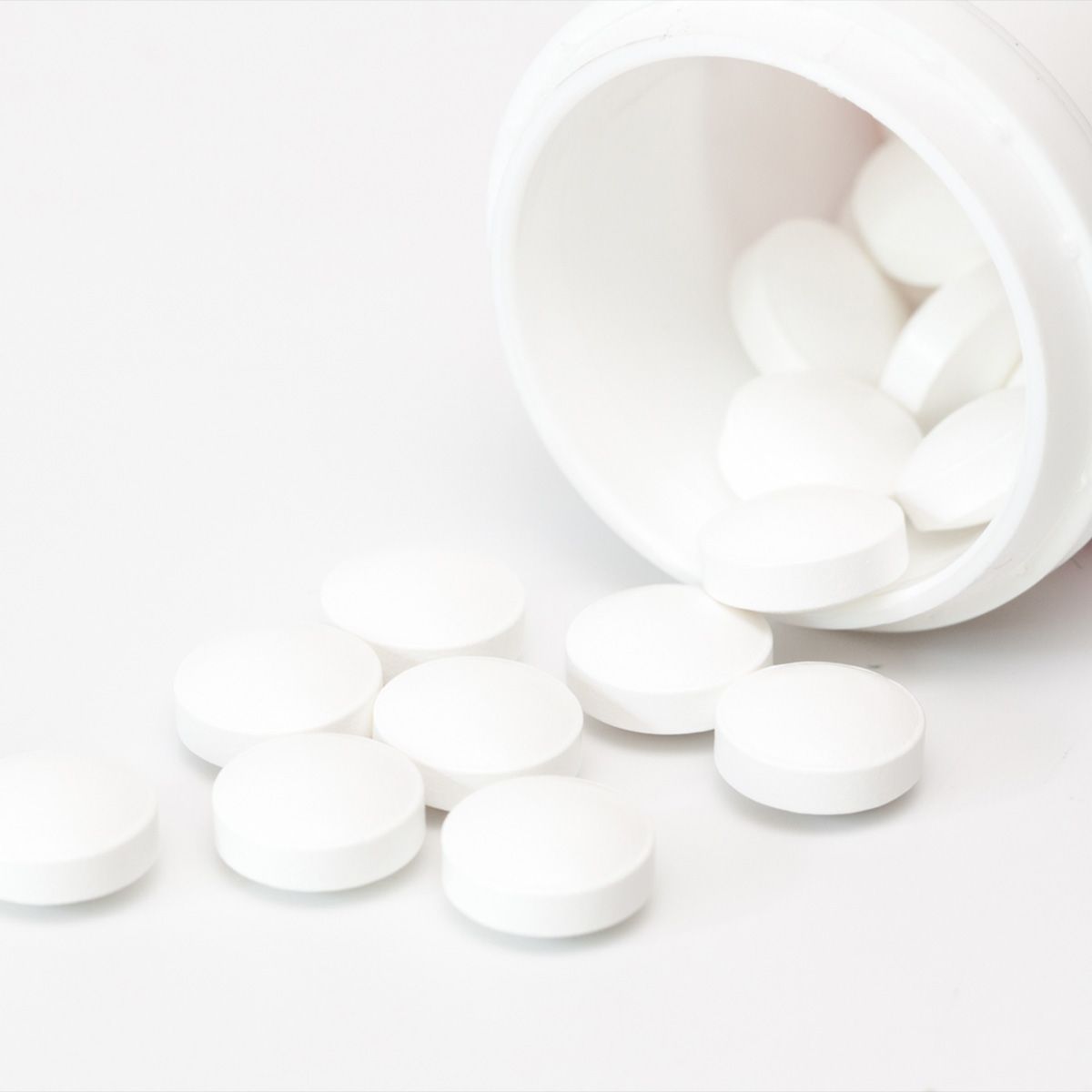 bottle of white pills on its side