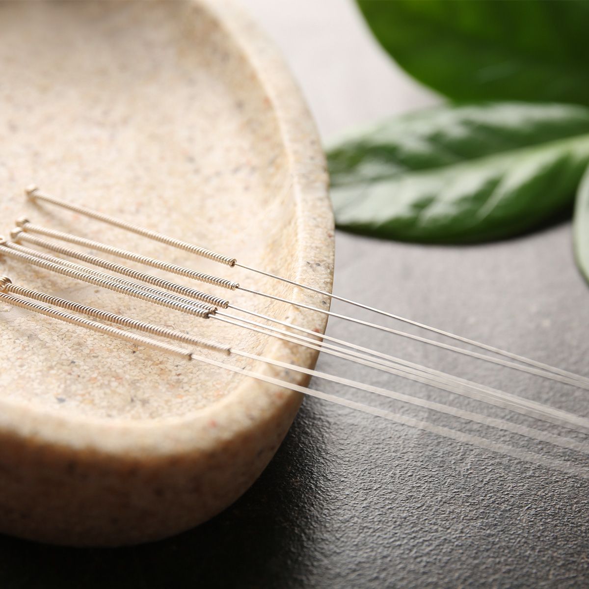 Photo of acupuncture needles resting in a bowl