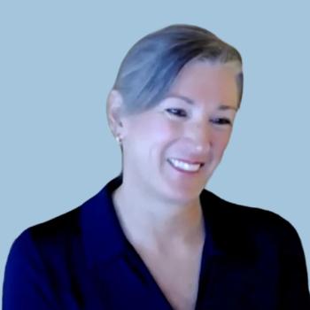 Image of a woman with gray hair on a light blue background