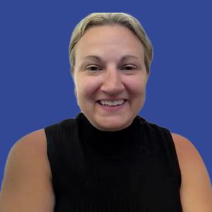 Image of a woman with blonde hair wearing a black shirt in front of a blue background