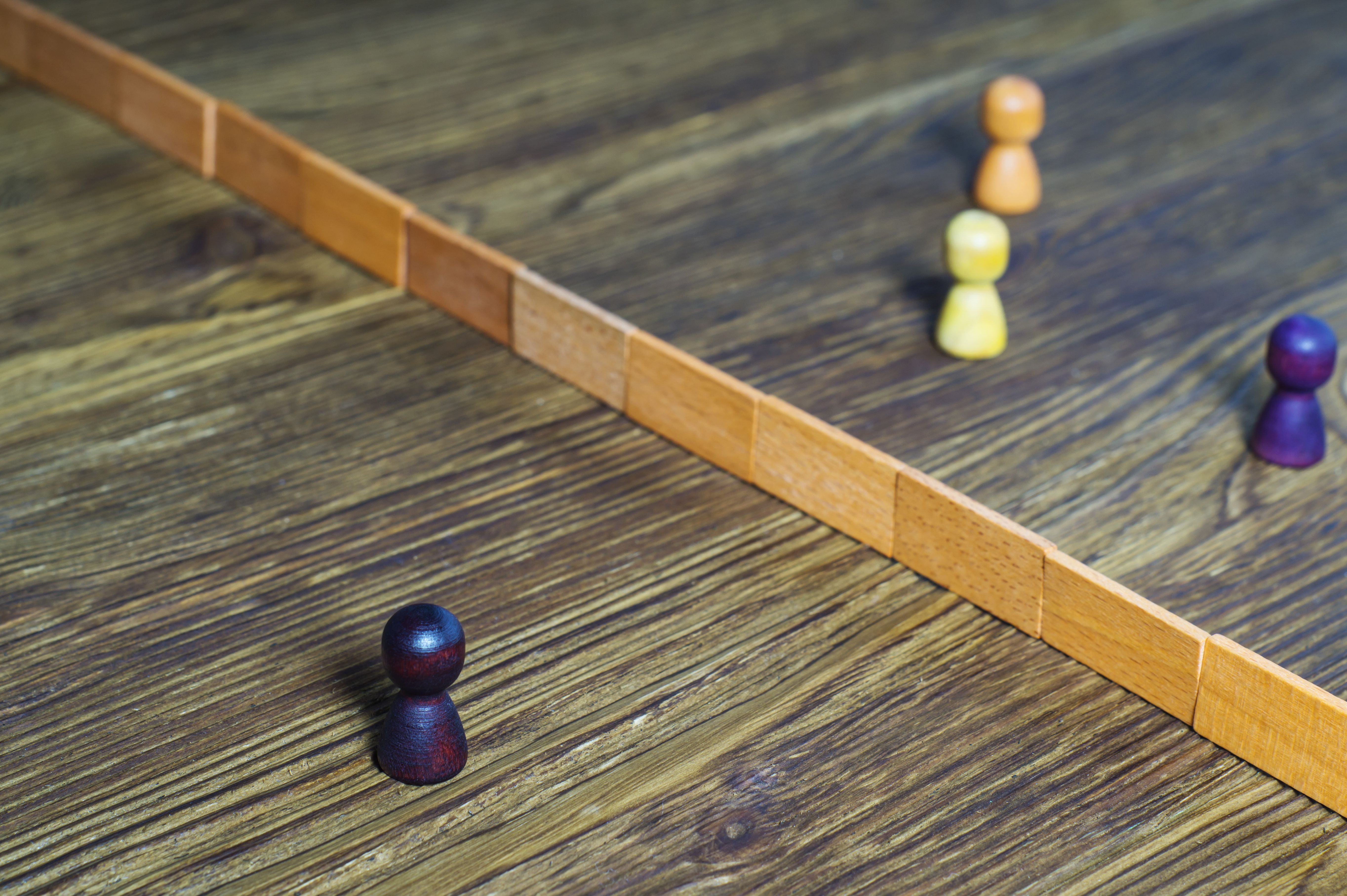 representation of someone feeling left out on the "other side" of the wall