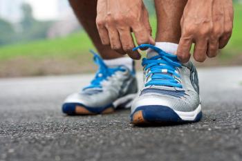 Man Ties Running Sneakers