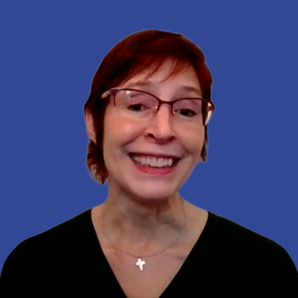 Image of a woman wearing glasses in front of a blue background